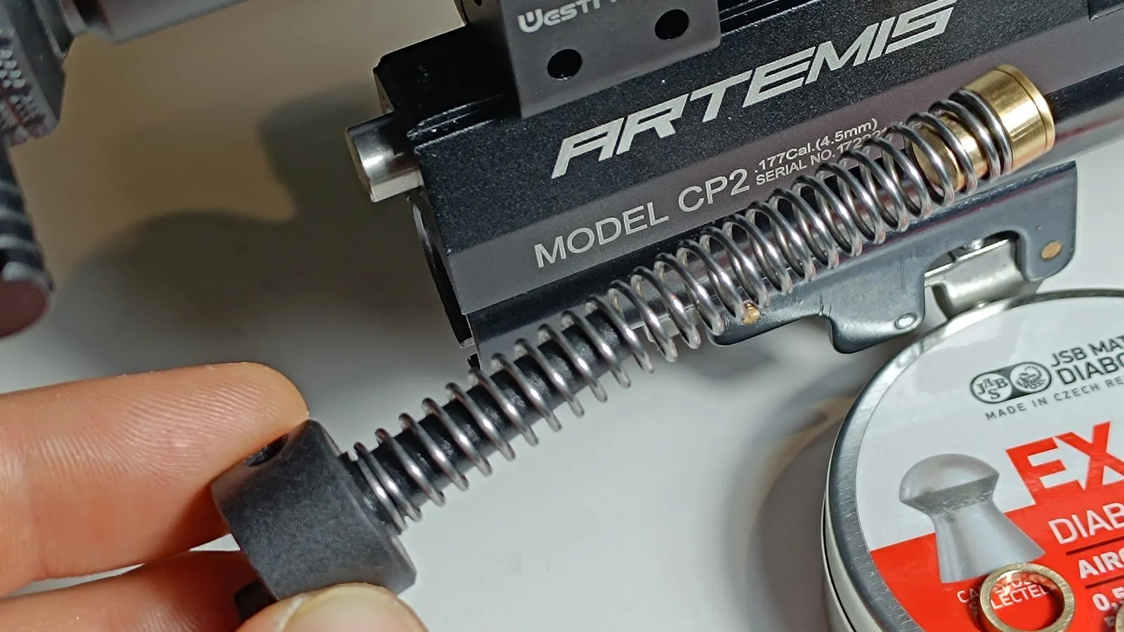 Hammer spring spacer